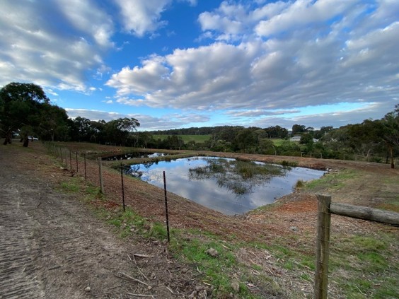 Retention pond for onsite wastewater treatment site